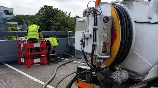 Vacuum tanker emptying an off-mains septic tank.
